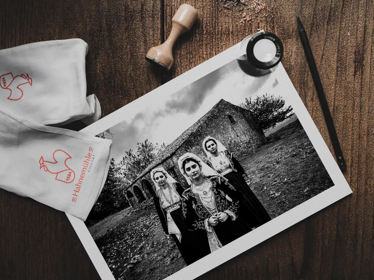 Black and White Photography Wall Art Greece | Costumes of northern Corfu island in front a traditional house Ionian Sea by George Tatakis - photo print on table