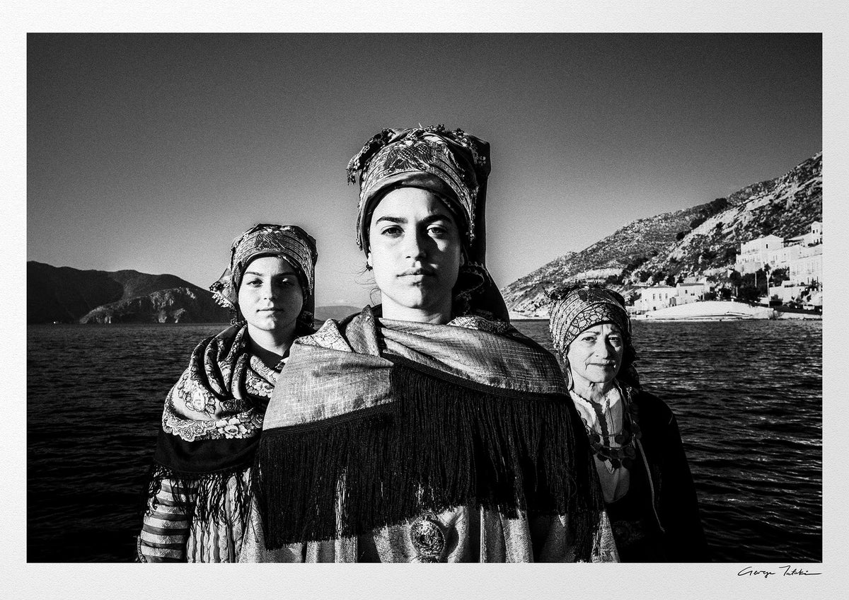 Black and White Photography Wall Art Greece | Three ladies on a boat in the traditional costumes of Symi island Dodecanese Greece by George Tatakis