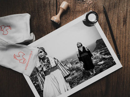 Black and White Photography Wall Art Greece | Costumes of Tilos island at a windy cliff Dodecanese Greece by George Tatakis - photo print on table