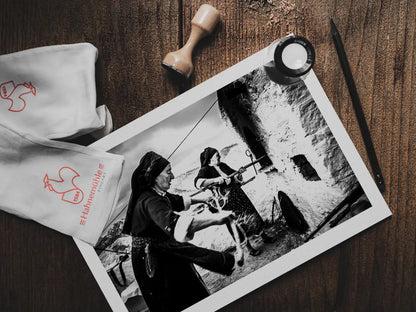 Black and White Photography Wall Art Greece | Women lighting up the wood oven Olympos Karpathos Dodecanese by George Tatakis - photo print on table