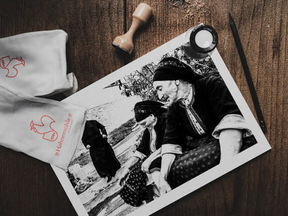 Black and White Photography Wall Art Greece | Two women in their traditional costumes the priest Olympos Karpathos Dodecanese by George Tatakis - photo print on table