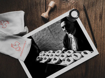 Black and White Photography Wall Art Greece | Baking cookies for Easter in Olympos Karpathos Dodecanese by George Tatakis - photo print on table