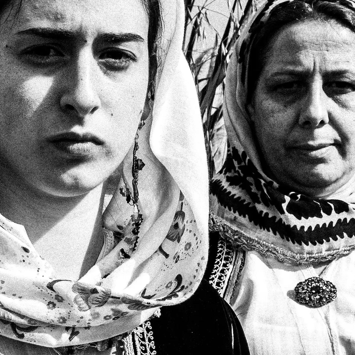 Black and White Photography Wall Art Greece by George Tatakis | Three women in the costume of Kymi in a field of straws, Euboea island - detailed view