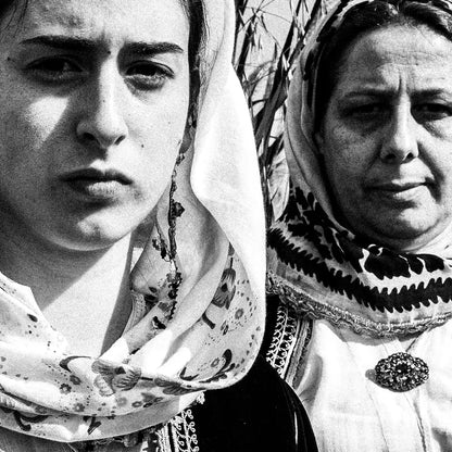 Black and White Photography Wall Art Greece by George Tatakis | Three women in the costume of Kymi in a field of straws, Euboea island - detailed view