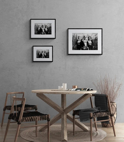 Black and White Photography Wall Art Greece by George Tatakis | Three women in the costume of Kymi in a field of straws, Euboea island - framing options