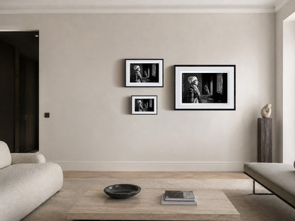 Woman in profile and two supporting figures in Kyparissia costumes, Peloponnese, Greece. Black and white photography frame sizing by George Tatakis.