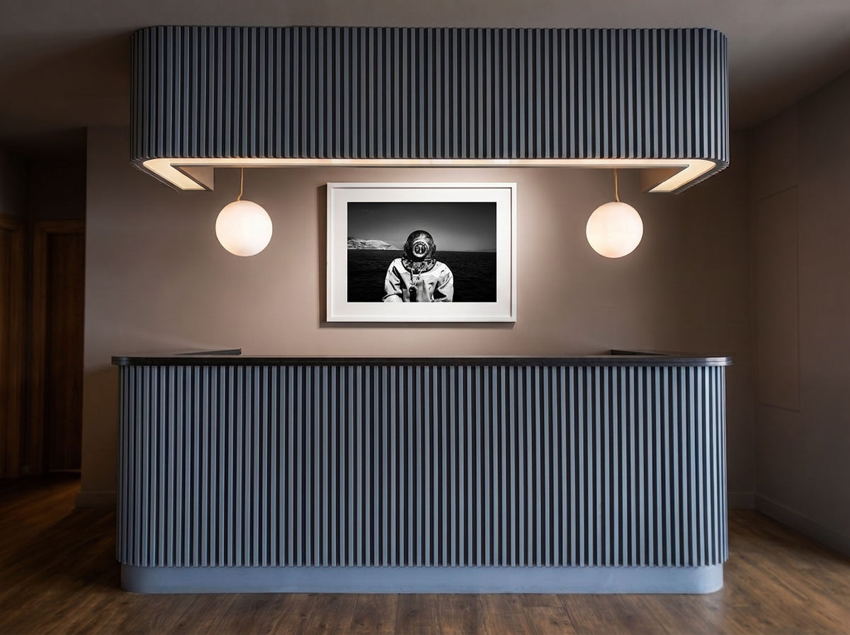 Sponge Diver limited edition black and white photography print by George Tatakis displayed at Varoulko Michelin-starred restaurant in Piraeus, Greece