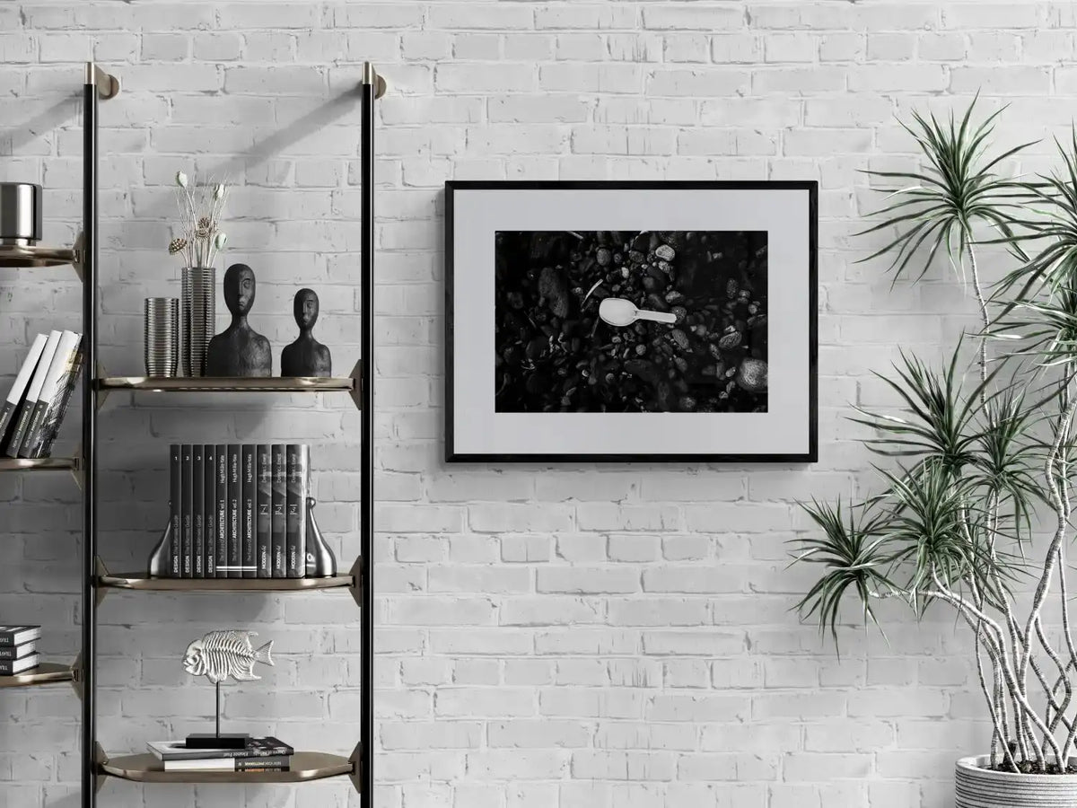 Black Pebbles and Shovel | Santorini | Chorōs | Black-and-white wall art photography from Greece