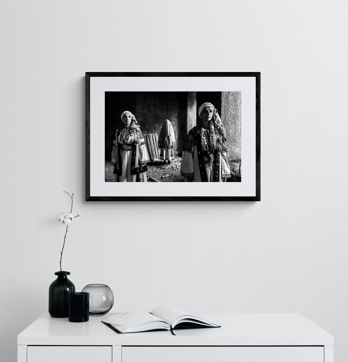 Veiled bride and two women in Kyparissia costumes, Peloponnese, Greece. Black and white photography framed on a wall by George Tatakis.