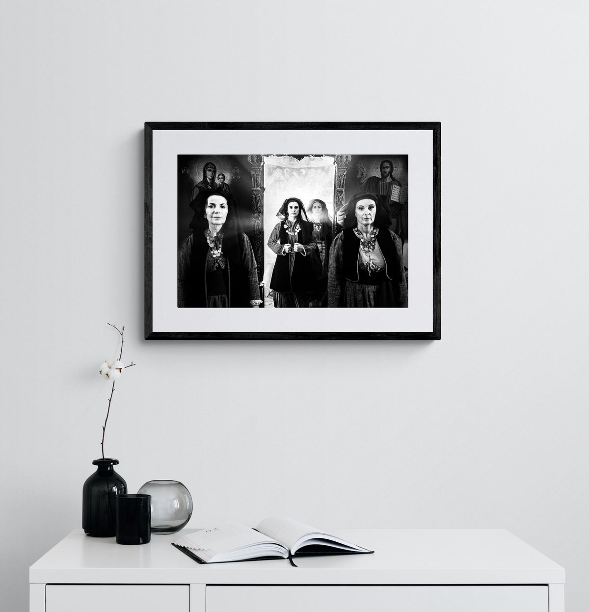 Four women in Alagonia local costumes at the church of the Mandraki Monastery, Alagonia, Peloponnese, Greece. Black and white photography framed on a wall by George Tatakis.